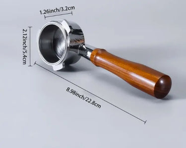 Coffee scoop with wooden handle and metal bowl, showing measurements on a gray background